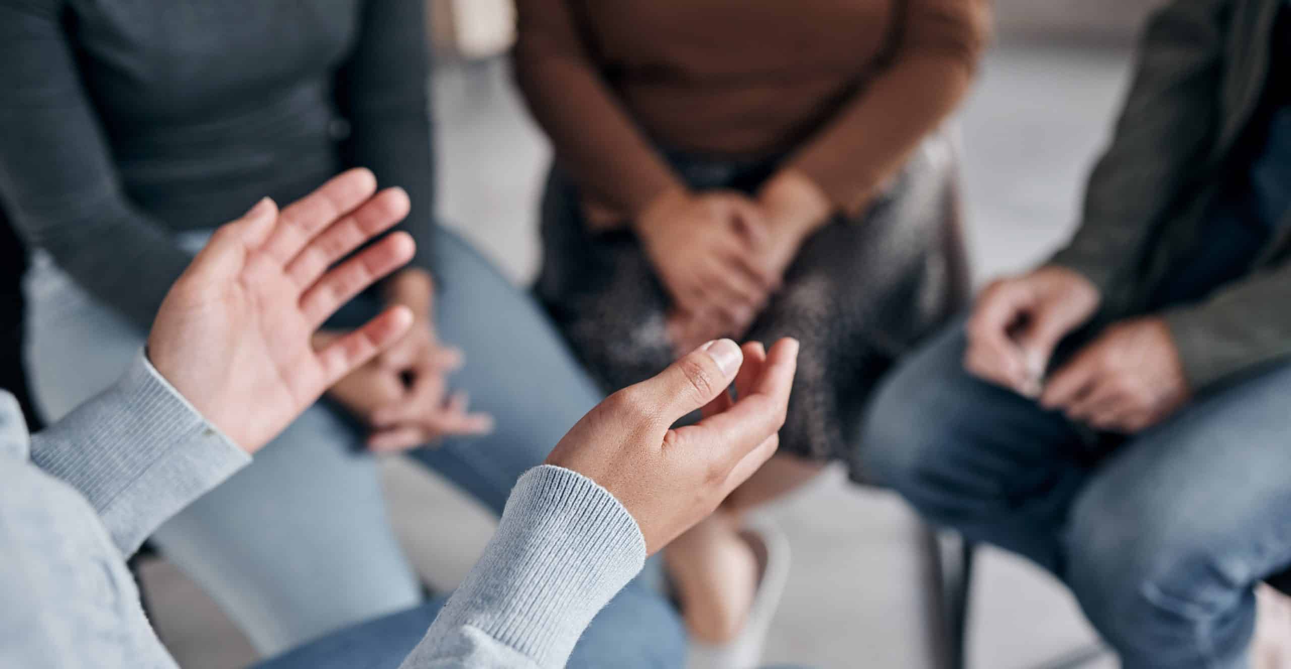 closeup of hands at support group