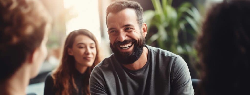 man smiling in therapy